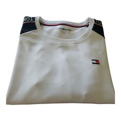 Tommy Hilfiger Sport Crewneck Sweatshirt. Embroidered Logo On Shirt. Round Crewneck. Color: White Black Long Sleeves. Tommy Hilfiger Written On Sleeves. 47% Polyester 47% Cotton 6% Spandex Unisex New Without Tags. Tommy Hilfiger Black Crew Neck T-shirt, Tommy Hilfiger White Crew Neck Top, Tommy Hilfiger Black Crew Neck Top, Tommy Hilfiger Sporty Black Tops, Tommy Hilfiger White Long Sleeve Tops, Tommy Hilfiger White Cotton Tops, White Cotton Tommy Hilfiger Tops, Black Long Sleeve, Crewneck Sweatshirt