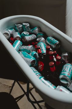 This shows a close up of a white enamel bath filled with iced water and alcohol Bar Displays