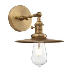 an antique brass wall light with a clear glass bulb