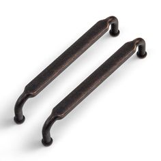 two antique style handles are shown on a white background