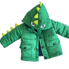 Dinosaur Coat Green Puffer Jacket Snap Button Toddler Little Me Unisex 12 Months New Without Tags Features: Awesome Scales Along 1 Arm And Hood Condition: New Without Tags Playful Long Sleeve Outerwear For Outdoor, Playful Cotton Outerwear For Outdoor, Playful Outerwear For Fall Playtime, Playful Long Sleeve Outerwear For Playtime, Playful Green Outerwear For Outdoors, Playful Green Outerwear For Outdoor, Playful Green Outdoor Outerwear, Playful Green Outerwear For Fall, Playful Green Long Sleeve Outerwear