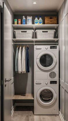 a washer and dryer in a closet with clothes hanging on the shelves next to each other