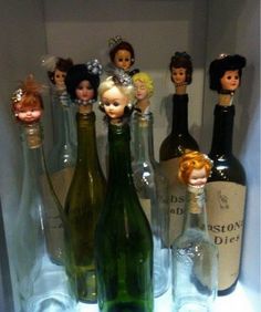 there are many bottles that have dolls in them