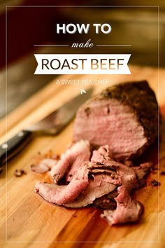 a piece of meat sitting on top of a wooden cutting board next to a knife