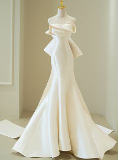 a white dress on display in a room