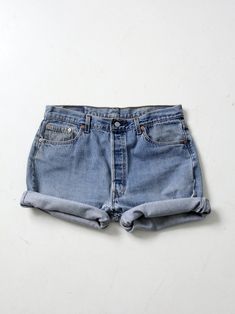 "This is a pair of vintage Levis 501 denim cutoffs. Lots of great wear and frayed hems make for classic jean shorts. Length allows for rolled hems. They have five pockets and button fly closure. CONDITION In good condition with wear consistent with age and use. Repair stitches near button fly. MARKED SIZE: 36 MEASURED SIZE: 35 MEASUREMENTS Waist 35\" .. 88.9 cm Inseam: 5.5\" .. 14 cm Hips: 46\" .. 116.8 cm Rise: 12\" .. 30.5 cm 52140" Repair Stitches, Pucci Dress, Pucci Vintage, Expensive Dresses, Hippie Boots, Vintage Levis 501, Vintage Clothing Online, Denim Cutoffs, Silk Mini Dress