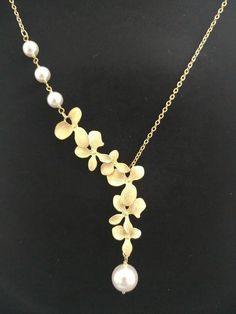 Cascade Triple white pearl Orchid flower Gold Silver Rose | Etsy Delicate Gold Lariat Necklace For Wedding, Elegant Flower Necklace With Clavicle Chain For Party, Gold Lariat Pearl Necklace For Weddings, Gold Lariat Clavicle Chain Necklace For Wedding, Gold Lariat Necklace With Clavicle Chain For Wedding, Gold Clavicle Chain Lariat Necklace For Wedding, Gold Pearl Drop Lariat Necklace For Wedding, Gold Lariat Necklace With Pearl Drop For Wedding, Gold Pearl Lariat Necklace For Wedding