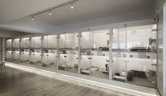 a room filled with lots of white cabinets