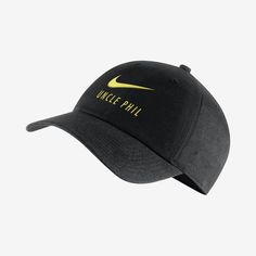 a black hat with yellow nike logo on it