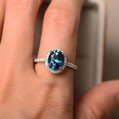 London blue topaz ring oval gemstone sterling silver halo | Etsy Elegant Topaz Halo Ring, Oval Blue Topaz Halo Jewelry, Oval Topaz Ring With Halo Setting, Elegant Oval Halo Ring With Birthstone, Oval Halo Topaz Ring For Anniversary, Oval Topaz Ring With Halo For Anniversary, Anniversary Oval Topaz Ring With Halo, Elegant Oval Topaz Halo Ring, Elegant Oval Topaz Ring With Halo