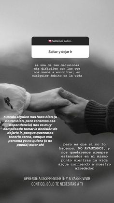 a black and white photo of two hands holding each other with the caption solita y dolar i