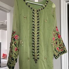 Kurta With Pants In Green With All Handwork On Sleeves Festive Wear Never Wore Its New Size Medium . Green Straight Pants For Festive Season, Festive Green Straight Pants, Green Festive Summer Pants, Festive Green Summer Pants, Summer Festive Green Pants, Fitted Green Festive Bottoms, Fitted Green Bottoms For Festive Occasions, Festive Fitted Casual Pants, Festive Fitted Green Bottoms