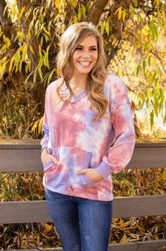 Lavender Tie Dye V-Neck Sweater – MOB Fashion Boutique Spring Crew Neck Top With Kangaroo Pocket, Crew Neck Top With Kangaroo Pocket For Spring, Cozy Relaxed Fit Top With Kangaroo Pocket, Comfortable Top With Kangaroo Pocket For Fall, Pink Crew Neck Top With Kangaroo Pocket, Casual V-neck Tops With Side Pockets, Casual Tops With Kangaroo Pocket For Spring, Comfy Tops With Kangaroo Pocket For Loungewear, Pink Long Sleeve Top With Kangaroo Pocket