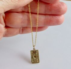 This is a vintage 9ct yellow gold ace of diamonds playing card charm on a 9ct gold chain which measures 44cm or 17 inches in length. The charm necklace weighs 2.8 grams and the card is 17mm by 10mm (5/8 inch by 1/2 inch) The card is hallmarked 375 for 9ct gold on the back and the chain is hallmarked 9ct on the clasp. Diamond Charm Necklace, Ace Card, Ace Of Diamonds, Charm Necklaces, Diamond Charm, Playing Card, Gems Jewelry, Vintage Charms, Gold Chain