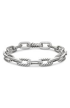 This chunky chain bracelet features alternating twisted and smooth links made of sterling silver and adds polished shine to any wrist stack. 7 1/2" length Push-clasp closure Sterling silver Imported Classic White Gold Bracelets With Chunky Chain, Classic White Gold Bracelet With Chunky Chain, Classic White Gold Chunky Chain Bracelet, Classic Chunky Chain Bracelet, Classic Sterling Silver Bracelet With Chunky Chain, Classic Sterling Silver Chunky Chain Bracelet, Classic Sterling Silver Bracelet With Chunky Oval Links, Wrist Stack, Wrist Stacks