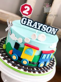 a birthday cake with a train on top