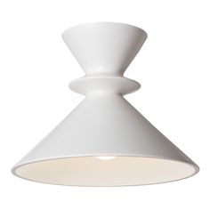 a large white light fixture on a white wall