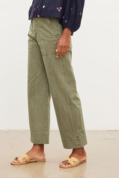 Inspired by the classic utility silhouette, we gave these cotton canvas pants a fresh take with a slim top and a flared leg, as well as a garment dye which shows off all the traditional details like patch pockets and over-sized belt loops. Velvet Tees, Canvas Pants, Cuffed Jeans, Utility Pants, Flare Leg Pants, Lifestyle Shop, Pair Of Pants, White Pants, Cool Fabric