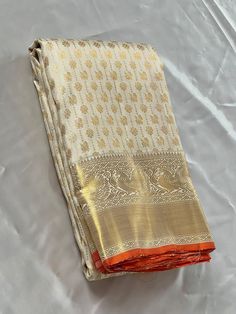 Bridal Collection White Color Pure Kanchipuram Silk Saree | Indian Traditional Ethnic Saree | Wedding or Party Wear Saree | Handwoven Gift Saree for Her Product Details : Saree Type : Pure Kanchipuram Silk Saree Golden Zari, Silk Mark Certified Blouse Piece : Yes (Un-Stitched) Saree Length : 5.5 Meters Blouse Piece Length : 80 cm Saree Weight : 0.9 kg Saree Fabric : Pure Kanchipuram Silk  Color : As shown in the picture Work : weaving Pattern : designer Occasion: Party Wear, Formal Wear, Festiva Traditional Pre-draped Cream Saree, Bollywood Style Off White Pre-draped Saree With Pallu, Wedding Tussar Silk Pre-draped Saree For Festivals, White Pre-draped Saree With Self Design, White Cutdana Pre-draped Saree For Puja, Eid Cutdana Pre-draped Saree For Puja, Off White Churidar With Cutdana In Traditional Drape, Navratri Off White Kurta With Pallu, Off White Churidar With Cutdana