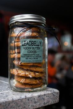 a jar filled with cookies sitting on top of a counter