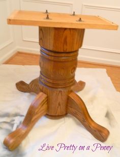 a small wooden table with two drawers on it