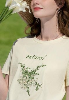 Bask in the pastoral allure of our Cottagecore Natural Tee. This breathable cotton-polyester top showcases high-quality floral embroidery. It's an idyllic addition to your wardrobe, evoking a serene, nature-inspired vibe, setting you apart from the urban crowd. Cottagecore aesthetic Cotton, polyester Crew neck High quality floral embroidery at front Short sleeve Cream Floral Embroidered Summer Tops, Cream Cottagecore Top For Spring, Cream Cotton Top With Floral Embroidery, Beige Floral Embroidery Top For Spring, Beige Floral Embroidered Cotton Tops, Cream Embroidered Spring Tops, Cream Embroidered Top For Spring, Cream Embroidered Cotton Tops, Cottagecore Beige Cotton Top