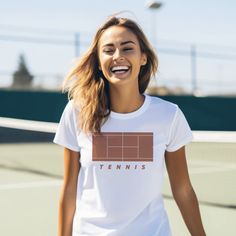 Introducing our Tennis-Inspired T-Shirt: Elevate your style both on and off the court with our dynamic tennis tee, designed for true tennis enthusiasts. Features: * 100% ring-spun cotton, lightweight fabric * Super soft * Unisex sizing * Back Design: BearRiver Signature line Fit: * Classic fit and crew neckline * This T-shirt runs true to size * For an oversized look, we recommend ordering 1-2 sizes up 🏷️ Tear-away label 🌿 Eco-Friendly Design 🎨 Athletic Heather is 90% cotton, 10% polyester Tennis Shirts Designs, Tennis Shirt, Tennis Shirts, Friendly Design, Trendy Tshirts, Tee Design, Lightweight Fabric, Crew Neckline, Minimalist Design