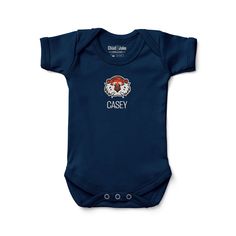 Personalized Auburn Tigers Baby Bodysuit: Perfect for Little Tigers Fans Welcome your little one to the Auburn Tigers family with the charming Auburn Tigers Baby Bodysuit. Made from 100% interlock cotton, this officially licensed bodysuit ensures your baby stays comfortable and cozy all day long with its super soft touch. Proudly featuring the Auburn Tigers logo and colors, it's a great way to start your baby's journey as a Wildcats fan. Available in a variety of sizes, including 0-3 MO, 3-6 MO, Blue Cotton Bodysuit For Loungewear, Blue Fitted Cotton Short Sleeve Bodysuit, Blue Cotton Onesie For Loungewear, Cotton Graphic Print Onesie For Loungewear, Fitted Soft-washed Cotton Onesie, Gender-neutral Cotton Bodysuit For Playwear, Cotton Short Sleeve Bodysuit For Playtime, Casual Blue Cotton Bodysuit, Family Matching Short Sleeve Cotton Bodysuit