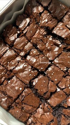 chocolate brownies in a pan with white sprinkles