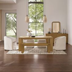 a dining room with wooden floors and white furniture