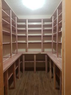 an empty room with wooden shelves in it