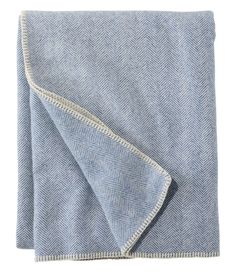 a blue and white blanket folded on top of each other