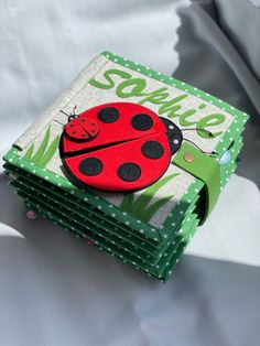 a ladybug book is stacked on top of each other