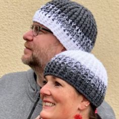 a man and woman wearing knitted hats