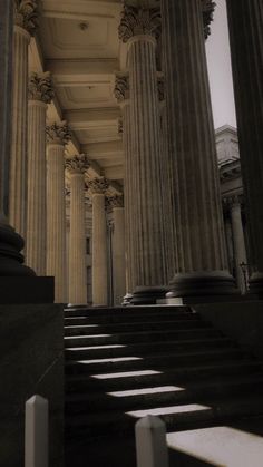 the stairs are lined with columns and pillars