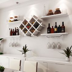 there are many bottles and glasses on the shelves above the table in this dining room