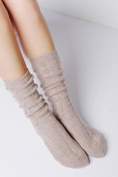 A beautiful cable knit design adds the perfect touch of detail to our ultra cozy Cable Cashmere Socks. They make for the perfect lounging staple or can be styled with your favorite boots. 105 grams of cashmere blend in 7-gauge knit Cable knit finish 96% Cashmere 1% Spandex 3% Nylon Hand Wash Cold or Dry Clean Only Size & Fit S/M: US women's 6-8 M/L: US women's 8-11 (men's size 6.5-9.5) Cashmere Socks, Favorite Boots, Boot Socks, Navy Color, Free Bag, Knitting Designs, Knee High Sock, Cable Knit, Cashmere