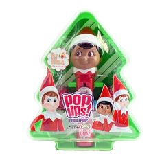 an elf doll in a christmas tree shaped box