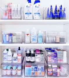 the shelves are filled with many different types of medicine and personal care products in plastic containers