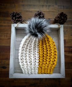 This hat is uniquely adorable; Half mustard yellow, half white cream and all gorgeous!  Made from a super soft acrylic-wool blended yarn from Big Twist Yarns, it's the perfect gorgeous accessory to any outfit! It's topped with a white and black luxury faux-fur pom and looks fantastic with so many different outfits, jackets and coats.  Size: Teen - Adult  *Note: This can be made in any size needed! Cream Hat, Big Twist, Yellow Hat, Half And Half, Black Luxury, Different Outfits, Fur Pom Pom, White Cream, Mustard Yellow