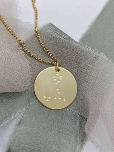 "♓ Pisces star sign (Feb 19 - Mar 20) Hand stamped constellation / star sign / astrology necklace, Pisces. This is a simple, minimalistic 20mm charm pendant that is made of 24kt plated gold. It comes with a 16\" necklace, or longer.  Discount applies if you prefer just the pendant itself (select chain length 0). The charm has a lovely shine that's bound to catch people's eyes. Choose two finishing designs: natural, or vintage finish (has dark dots). Model is wearing a 24\" chain.  This is a great gift for Christmas, birthdays, bridesmaid, stocking stuffers, Valentine's day, friends, or yourself, just because. Lovingly handmade in Vancouver, BC, Canada." Minimalist Zodiac Sign Round Pendant Necklace, Everyday Zodiac Sign Round Jewelry, Minimalist Zodiac Sign Round Pendant Jewelry, Minimalist Zodiac Sign Jewelry, Minimalist Round Zodiac Sign Necklace, Gold Minimalist Zodiac Charm Necklace, Minimalist Gold Zodiac Sign Jewelry, Gold Minimalist Zodiac Sign Jewelry, Minimalist Gold Zodiac Jewelry