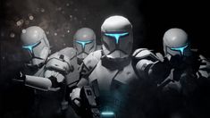 three sci - fi characters are standing in the dark