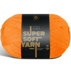 an orange ball of yarn with the words super soft yarn written on it in black