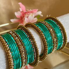 This includes 2 half stacks  Gold and Sea Green/ turquoise, limited edition in 2.6 only ✨ Ready to ship 📦 Stackable Green Beaded Bracelets, Stackable Turquoise Bangle Jewelry, Turquoise Stackable Bangle Jewelry, Green Metal Bracelets For Festive Occasions, Festive Green Beaded Bangle Bracelets, Turquoise Bangle Jewelry For Wedding, Turquoise Metal Bangle As A Gift, Turquoise Metal Bangle As Gift, Turquoise Metal Bangle For Gift