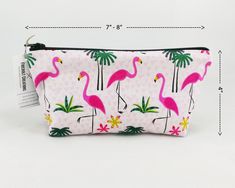 "A tropical - 3 Piece Toiletry Bag Set to store all your makeup, bathroom, shaving and other accessories with a Sleep Mask! Flamingo fabric features a fun print of pink flamingos walking about with green palm trees and yellow flowers in the background. Canvas on bottom/back of Toiletry Bags is solid black. Strap on Sleep Mask is Black. Set includes: 1 Large Toiletry Bag, 1 Small Toiletry Bag, 1 Sleep Mask See below for specifications: Large Toiletry Bag: - approximately 10\"-11\" long x 7\" tall Pink Rectangular Cosmetic Bag For Summer, Summer Pink Rectangular Cosmetic Bag, Trendy Pink Cosmetic And Toiletry Storage Gift, Playful Pink Cosmetic Bag For Gift, Pink Zipper Pouch For Cosmetics And Toiletries Gift, Pink Cosmetic And Toiletry Storage Zipper Pouch As Gift, Pink Cosmetic Storage Zipper Pouch As Gift, Pink Gift Cosmetic And Toiletry Storage With Zipper, Trendy Pink Cosmetic Bag Gift