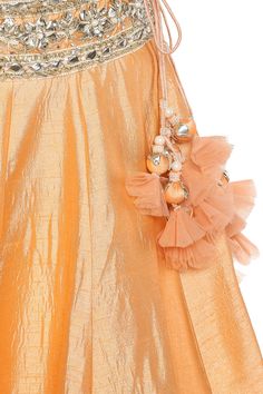 A winning style this wedding season is this opulent peach lehenga set. Boasts of a tie-up back blouse and enhanced with glistening gota patti and pearl embellishments, this vibrant beauty is coordinated with a matching dupatta. 
comes with dupatta
gota patti work
pearl embellished
tie up back blouse - Aza Fashions Rok Tile, Peach Lehenga, Gota Patti Work, Embroidered Lehenga, Set For Women, Aza Fashion, Wedding Season, Lehenga, Tulle Skirt