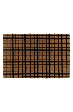 a brown and black plaid rug on a white background