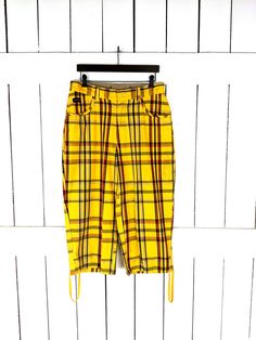 90s vintage yellow plaid wide leg cropped cotton pants   Measurements...taken flat -marked size: missing label -across waist: 16" -across hip: 22" -inseam: 20.5" -rise: 12" Features... -hues of yellow/black red plaid -100% cotton -drawstring cuff -front and back pockets -relaxed fit -LJ Freud  Condition... -excellent vintage condition  -gently worn -minor color bleeding near the cuffs Vintage Wide Leg Yellow Bottoms, Vintage Yellow Wide-leg Bottoms, Yellow Cotton Bottoms For Fall, Yellow Cotton Pants For Fall, Yellow Cotton Fall Pants, Fall Yellow Cotton Pants, Womens Trousers, Womens Capris, Yellow Plaid