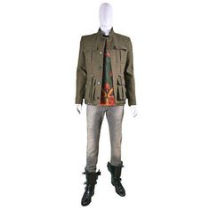 This khaki-green gabardine jacket is a streamlined take on a utility style with padded shoulders – a signature of the house – hidden front button closure, and flap-front pockets. Main - 100% Wool Body Lining - 100% Cotton Sleeve Lining - 100% Cupro Pocket Lining - 100% CottonDesigner Style ID: W4HT735C624Made in FranceSize FR48 - S Shoulder to shoulder 17" Pit to pit 19.5" Waist 36" Length 27.5" Size FR50 - M Shoulder to shoulder 18" Pit to pit 20.5" Waist 37" Length 27.5" Fall Khaki Blazer With Flap Pockets, Khaki Military Style Winter Blazer, Fall Utility Style Khaki Blazer, Green Utility Jacket With Cargo Pockets For Workwear, Military Style Khaki Blazer With Flap Pockets, Khaki Military Blazer With Flap Pockets, Green Utility Jacket With Flap Pockets For Work, Military Style Green Blazer For Fall, Fall Military Green Blazer