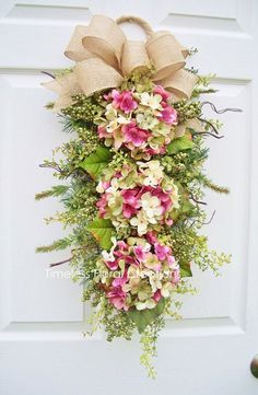 the door is decorated with pink and white flowers